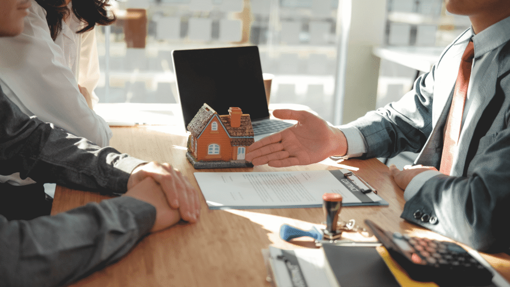 Mortgage advisor explaining home loan options to clients in a bright office